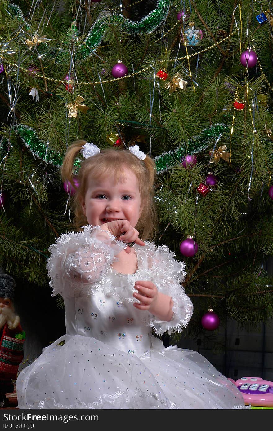 Girl on a background of a New Year tree