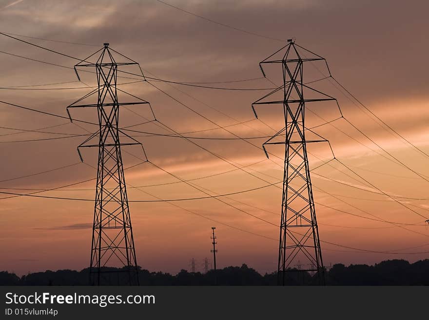 Power lines and Cell Tower at sunset