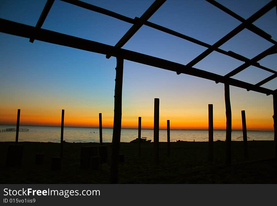 Seaside evening landscape with ruinous building