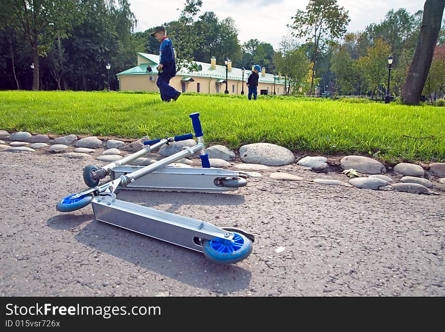 Scooters, laying on road pending the owners