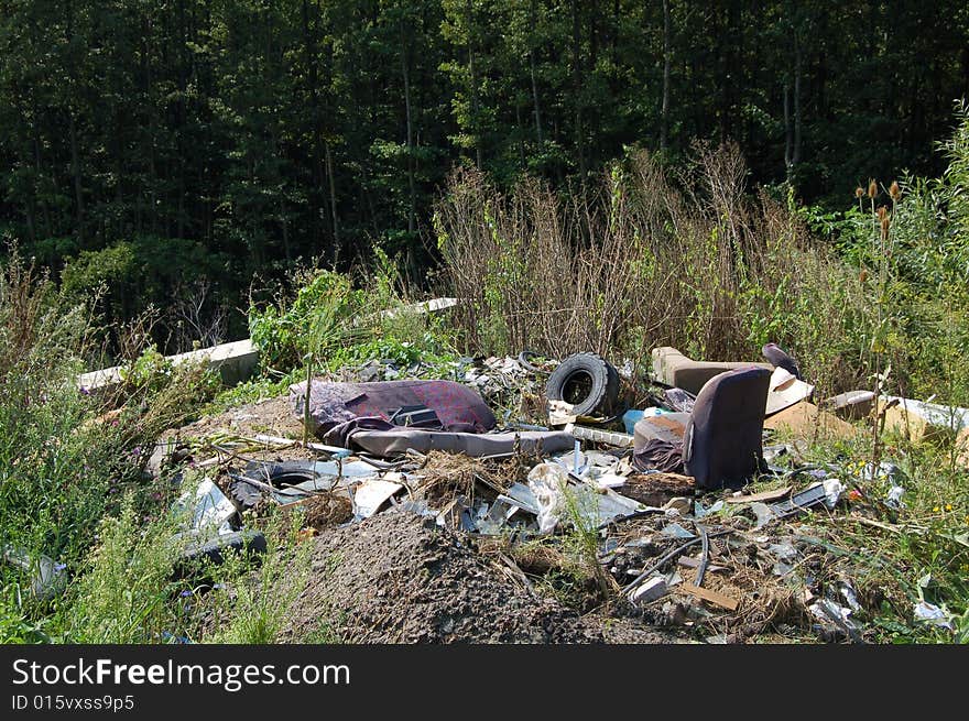 Illegal junkyard in the middle of nature area. Illegal junkyard in the middle of nature area