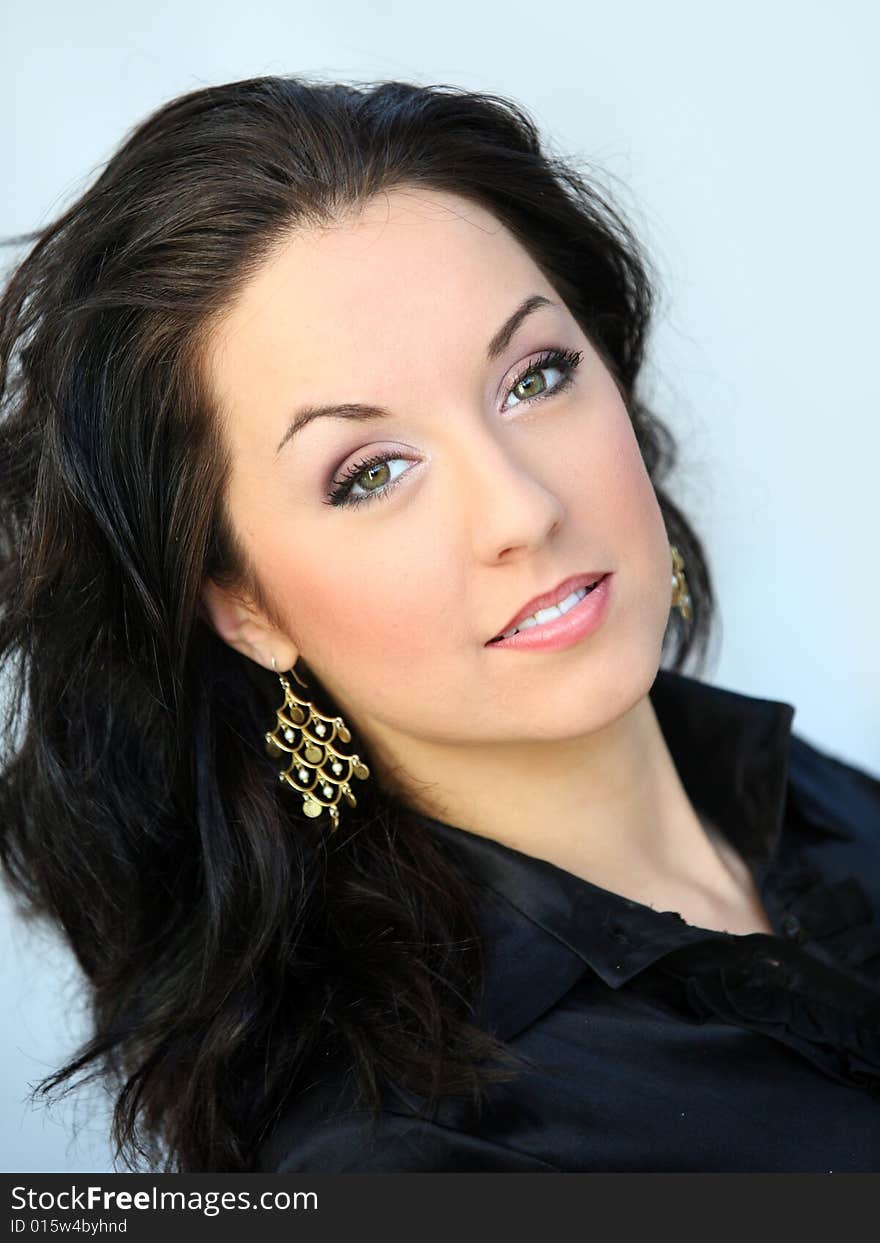 Portrait of a young brunette woman with green eyes. Portrait of a young brunette woman with green eyes