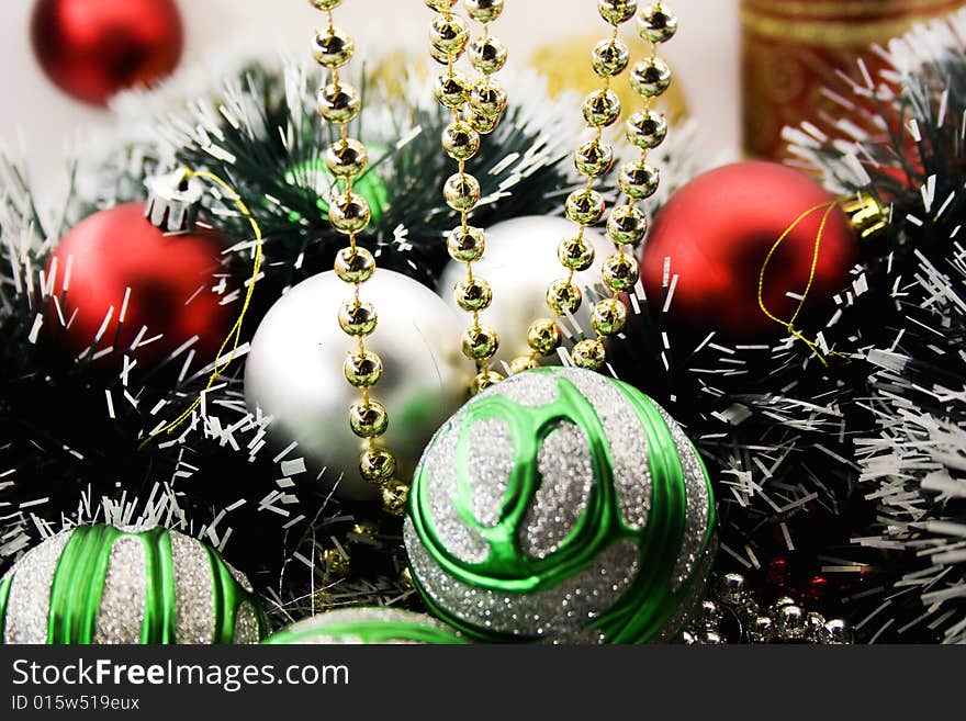 Multi-coloured Christmas-tree decorations close up