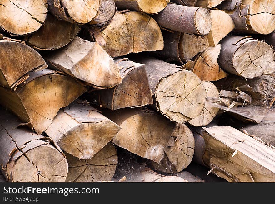 Image of a stack of firewood close-up. Image of a stack of firewood close-up