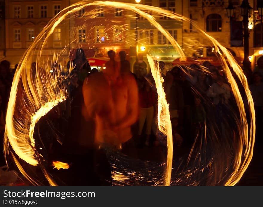 Street artists performing magic at night. Street artists performing magic at night