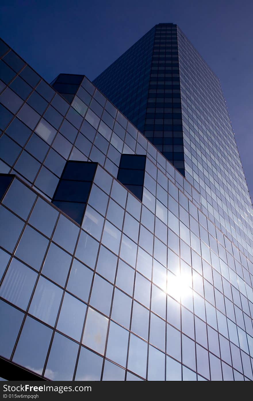 Office building on a background of the blue sky. Office building on a background of the blue sky