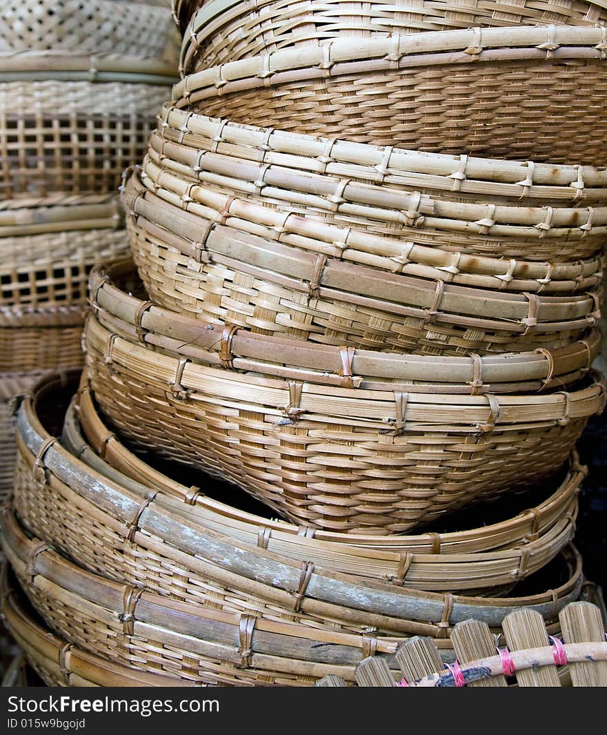 a pile of bamboo baskets close up