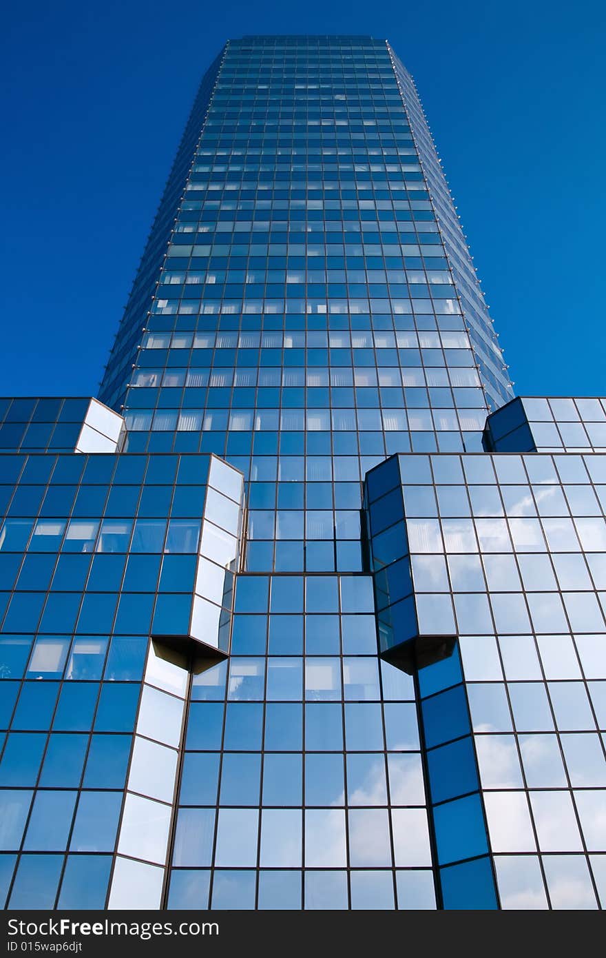 Blue skyscraper on a clear blue sky background