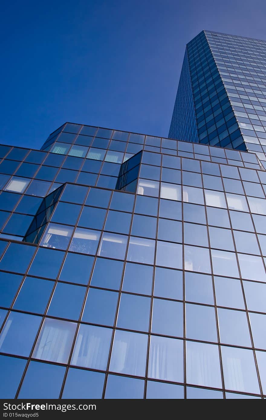 Blue skyscraper on a clear blue sky background