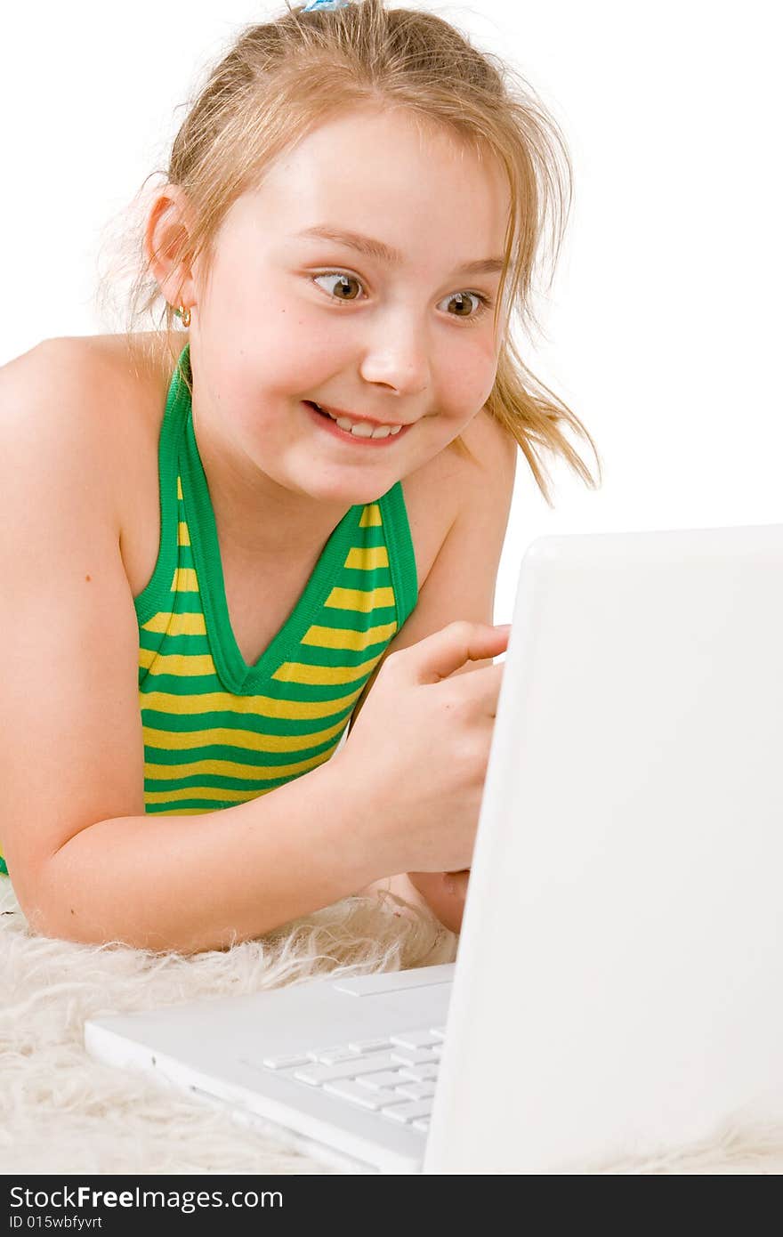 An attractive girl looking at a white laptop