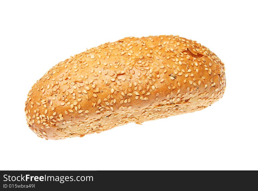 Sesame seeded torpedo bread roll isolated on white. Sesame seeded torpedo bread roll isolated on white