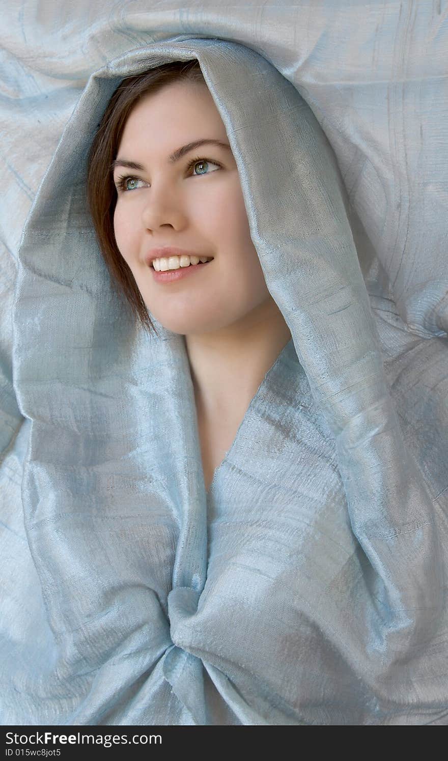 A beautiful smiling girl with blue scarf