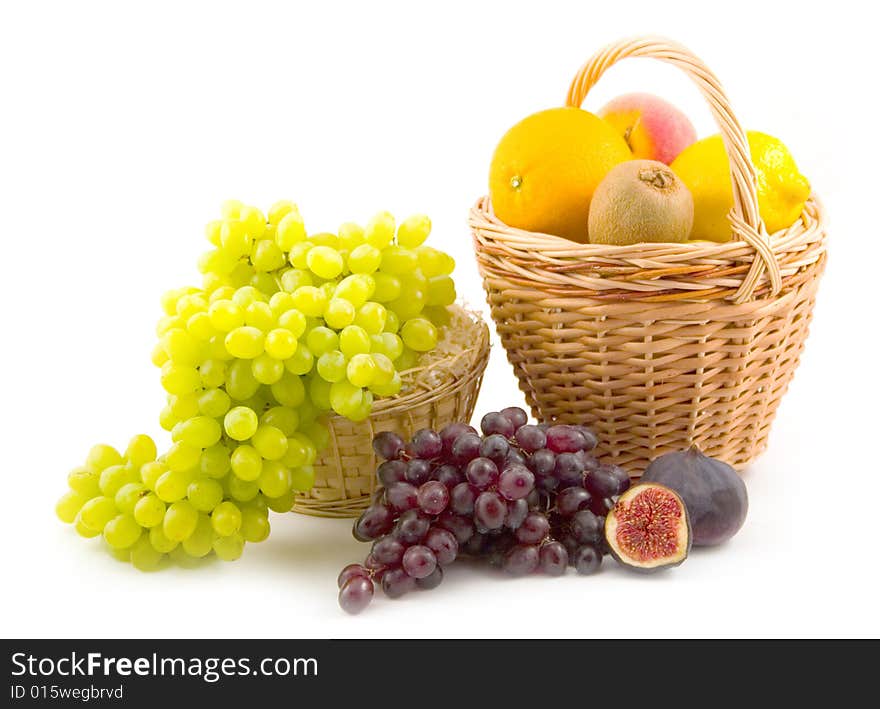 Many different and tasty fruit grapes fig peach lemon on white background