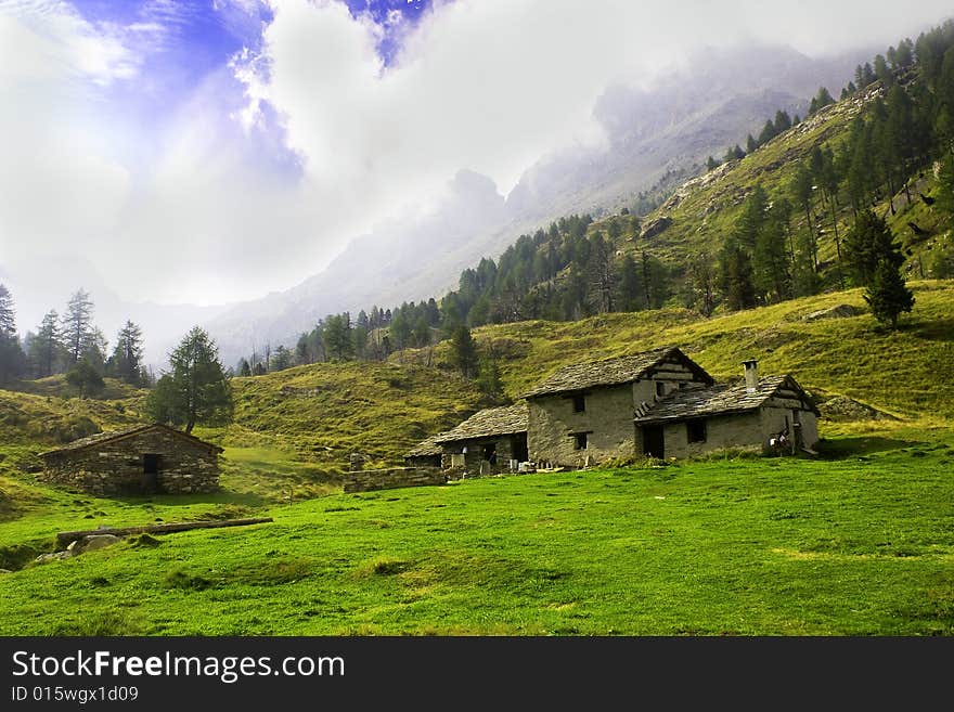 Mountain landscape with stone huts. Mountain landscape with stone huts