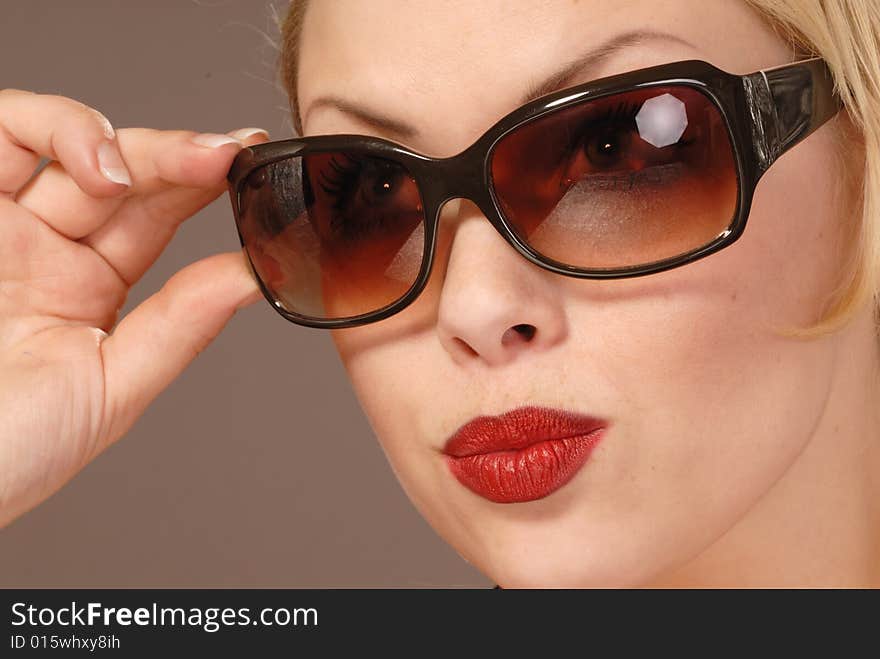 Fifties style beautiful girl in large sunglasses. Fifties style beautiful girl in large sunglasses