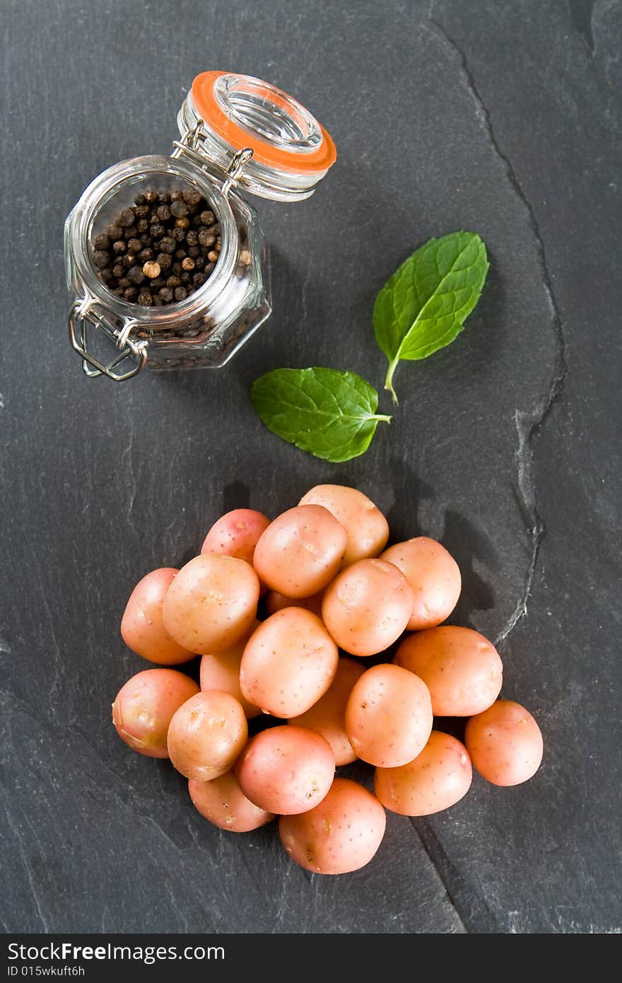 Pile Of New Potatoes With Pepper And Mint