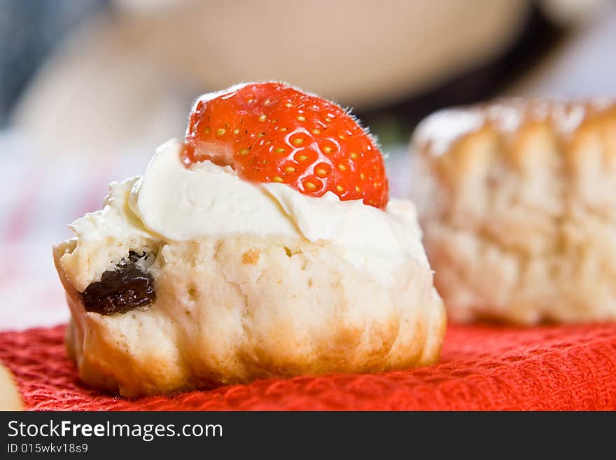 Close up of a scone with clotted cream