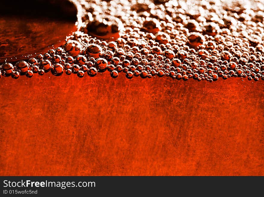 Grunge orange background with water bubbles and old paper