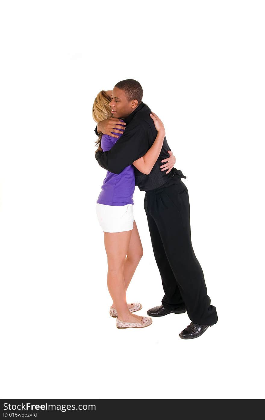 Interracial couple hugs each other isolated on white background. Interracial couple hugs each other isolated on white background