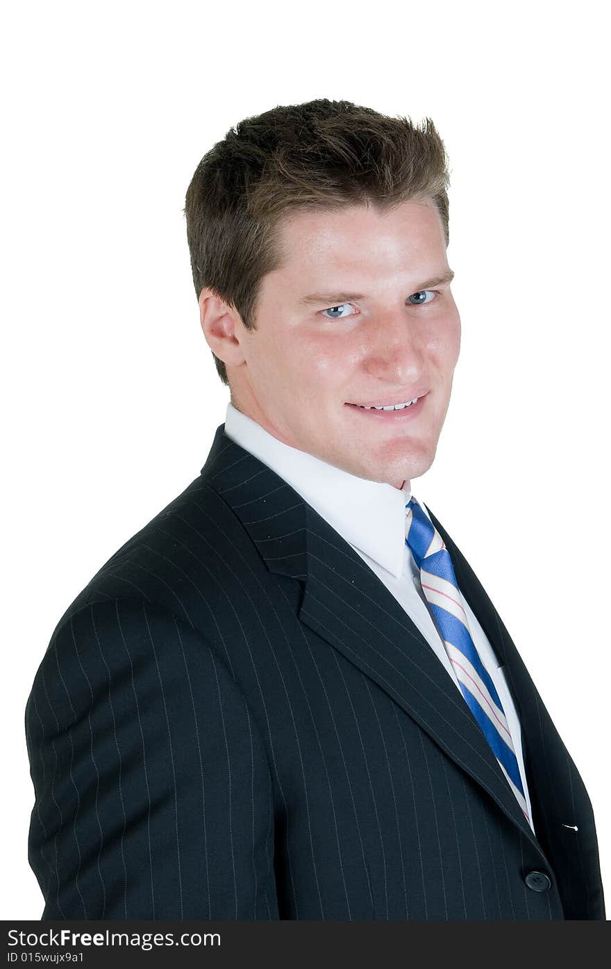 Young businessman stands on isolated white background