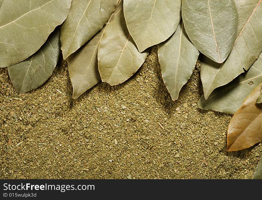 Dried bay leaves on its powder background.