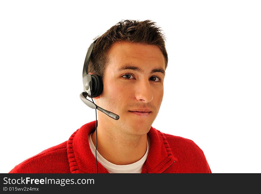 Handsome young man with hands-free headset isolated on white background. Handsome young man with hands-free headset isolated on white background