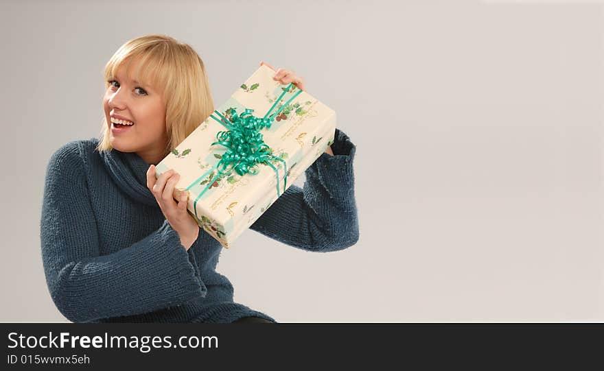 Pretty blond girl with Christmas present