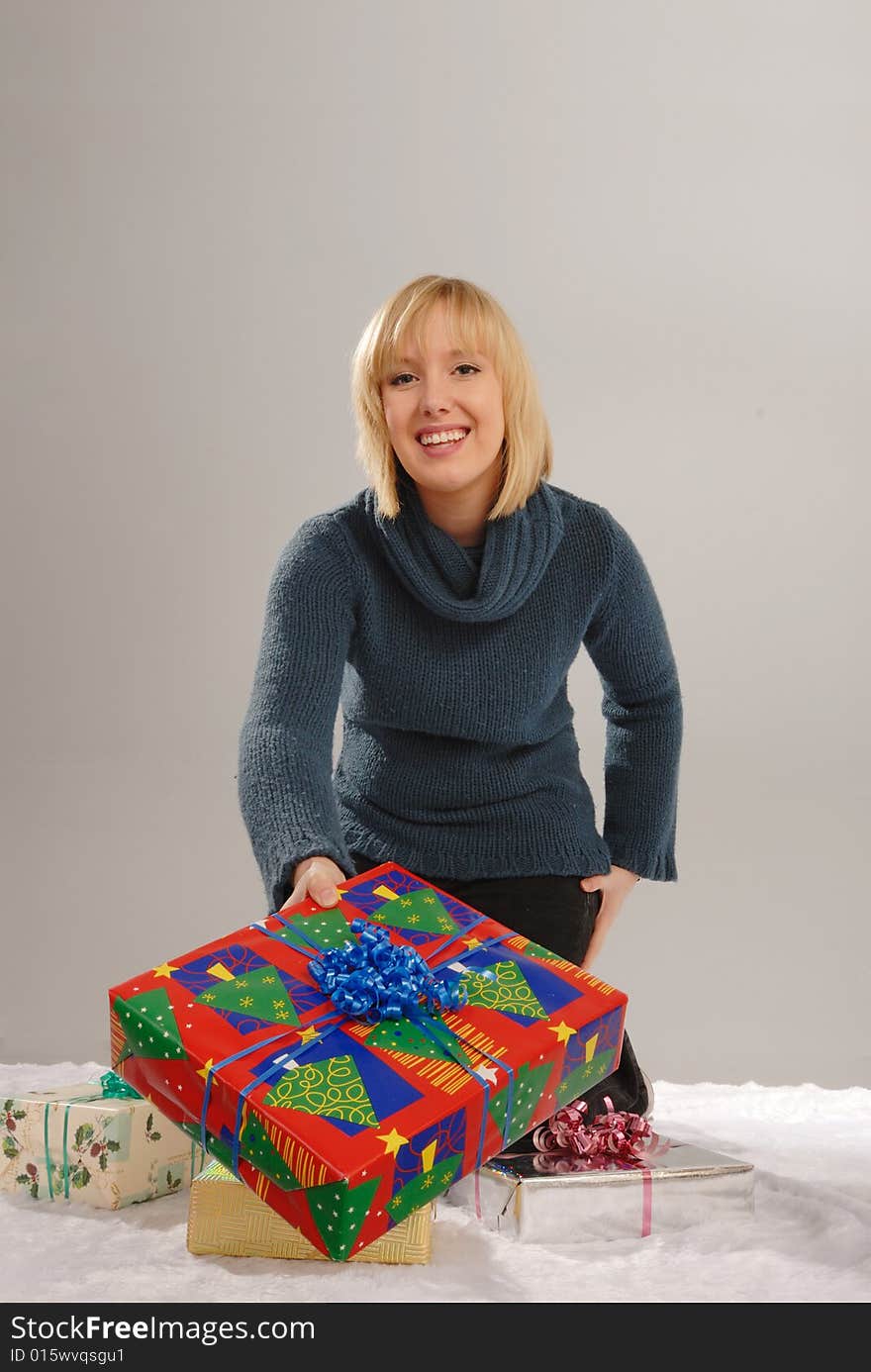 Cute blond giving Christmas gift