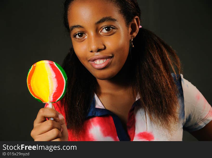 Portrait of cheerful african american child with lollipop. Portrait of cheerful african american child with lollipop