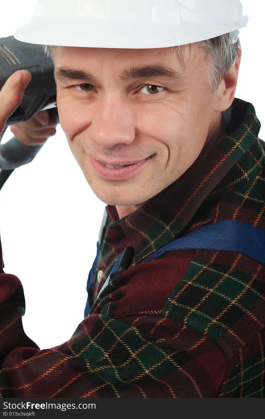 Muscular professional man in a builder uniform with tools. Muscular professional man in a builder uniform with tools.