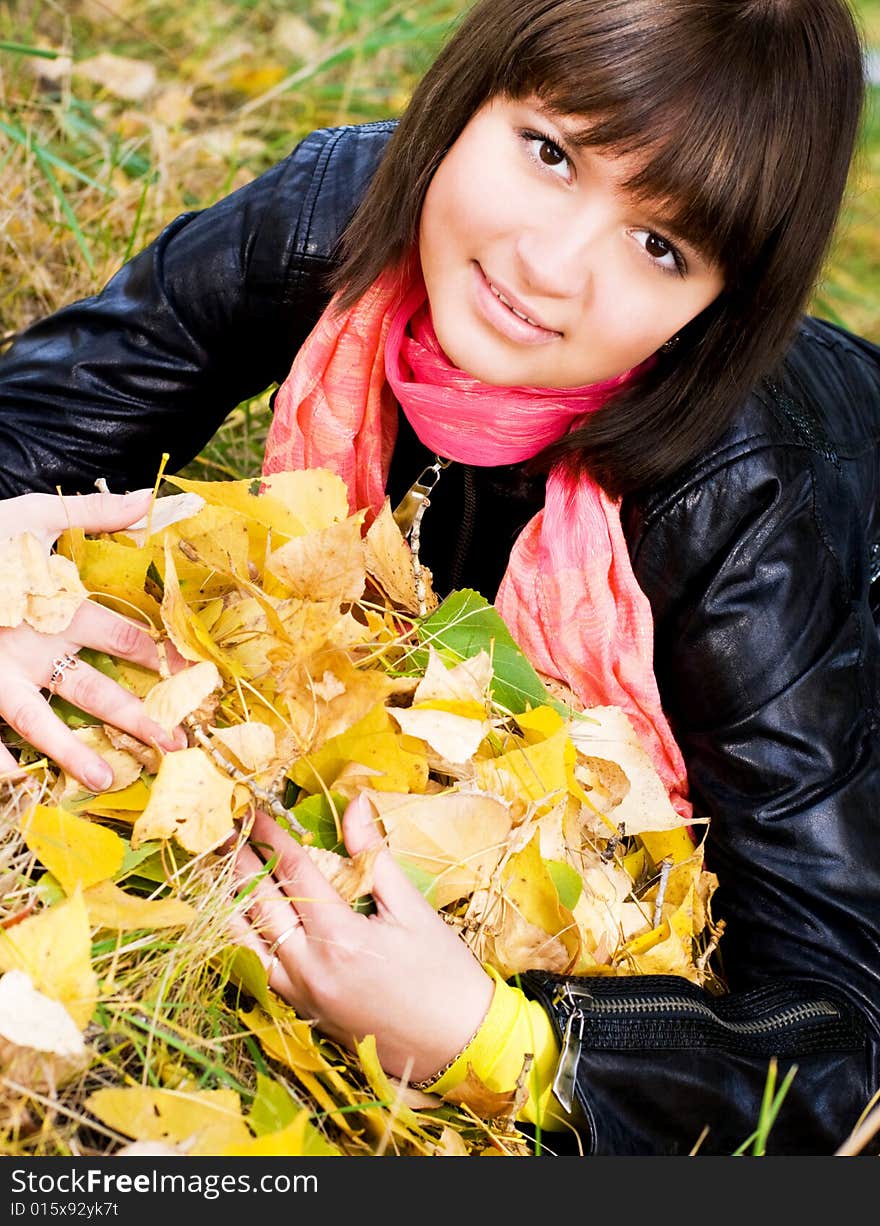 Pretty girl with yellow leaves