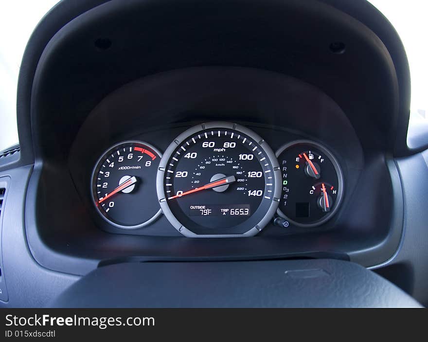 Close-up, extreme wide angle photo taken from the driver's view of the dash gages. Close-up, extreme wide angle photo taken from the driver's view of the dash gages.