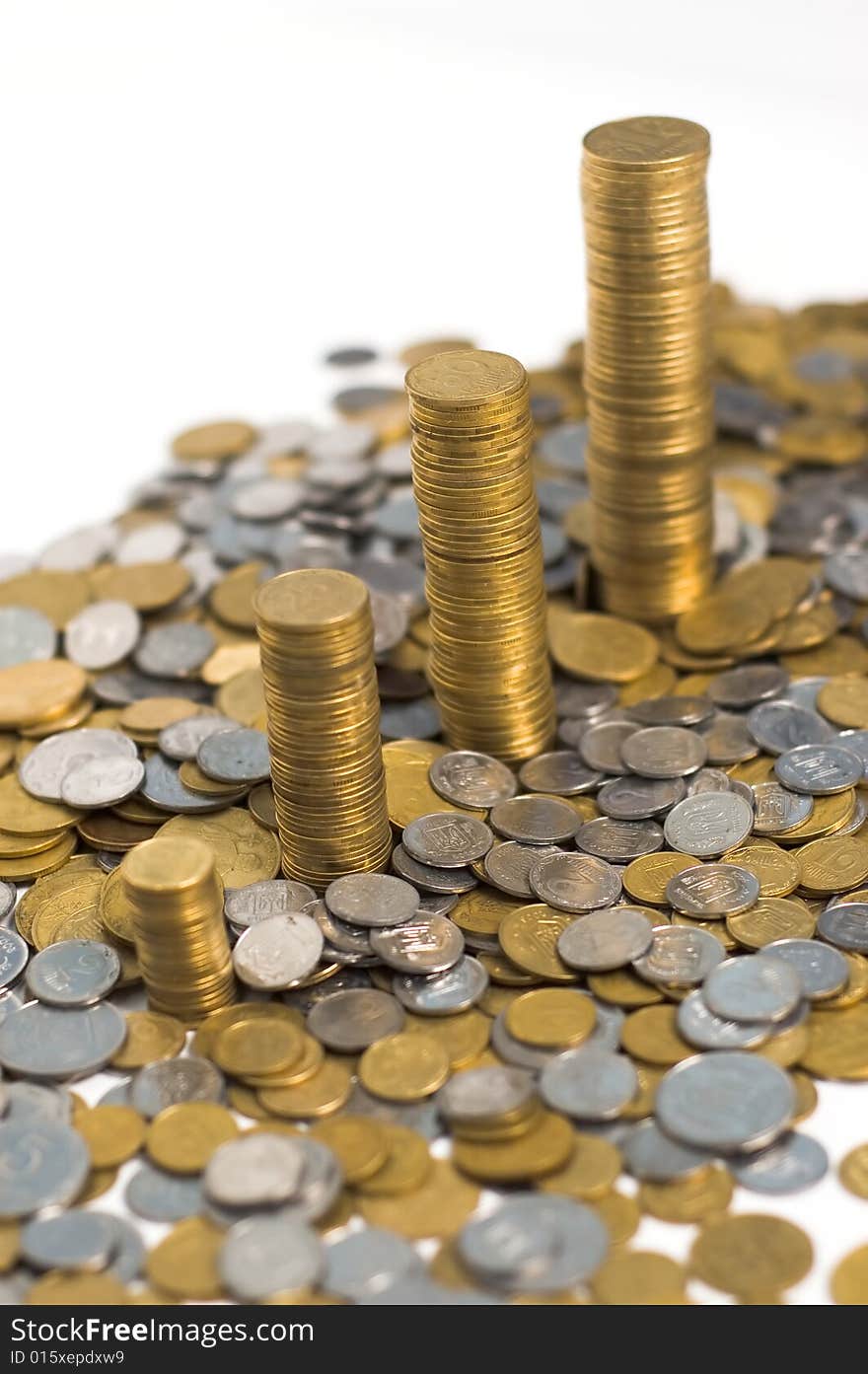 Four pils of coins isolated on the white background. Four pils of coins isolated on the white background