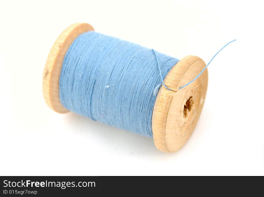 Isolated blue spool on white background. Isolated blue spool on white background