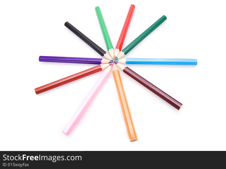 Closeup of a collection of colorful pencils forming a star. Isolated on white. Closeup of a collection of colorful pencils forming a star. Isolated on white.