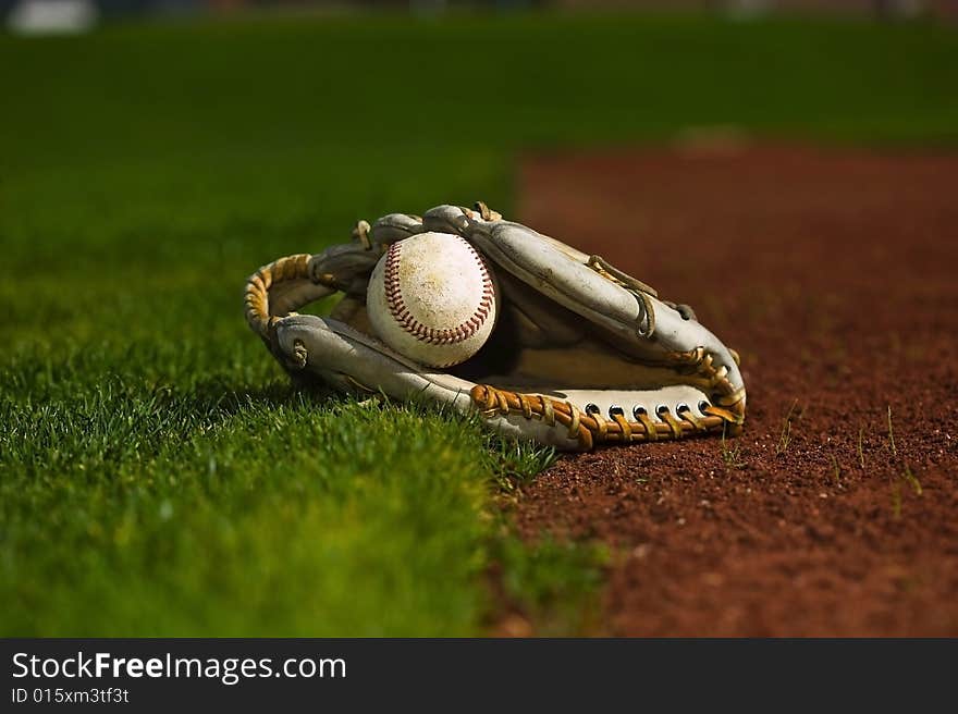 Baseball In Glove On The Field