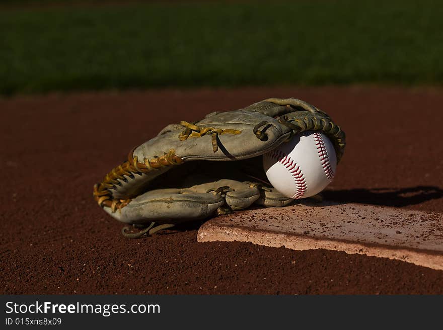 Baseball In Glove On The Field