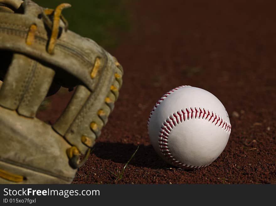 Baseball In Glove On The Field