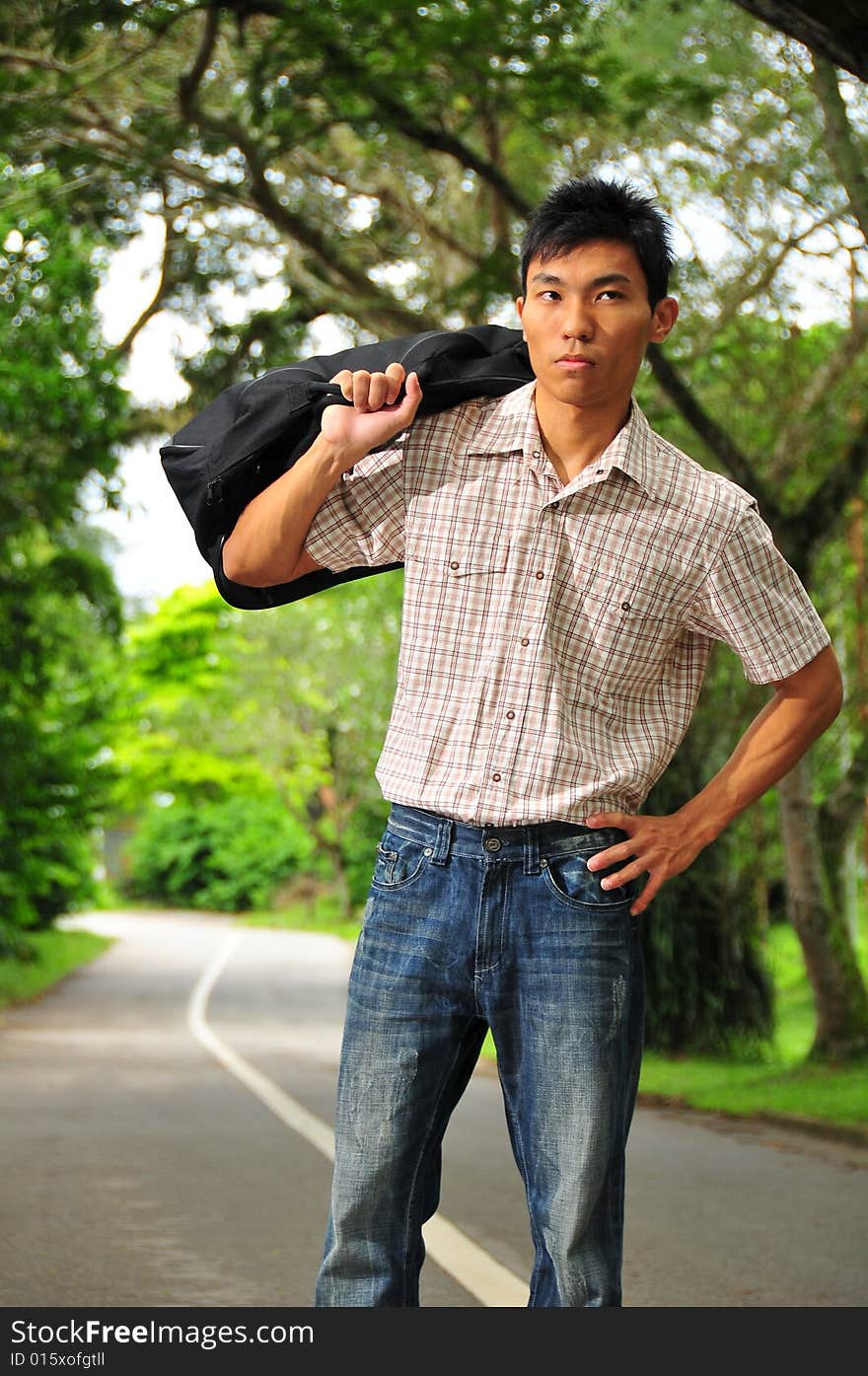 Picture of an Asian Hitchhiker. Suitable for cross country picture or the context of how someone should move ahead. Suitable for holidat, casual picture as well. Picture of an Asian Hitchhiker. Suitable for cross country picture or the context of how someone should move ahead. Suitable for holidat, casual picture as well.