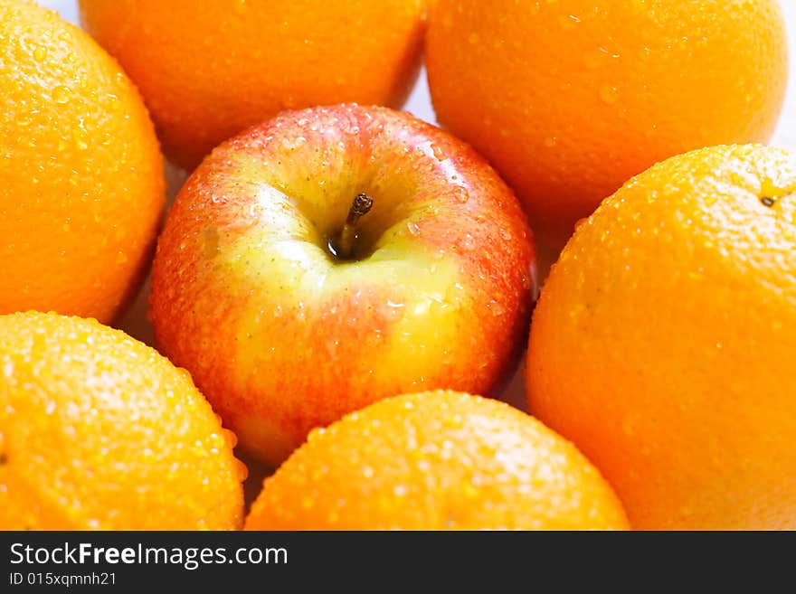 Apples and oranges isolated on a white background. Apples and oranges isolated on a white background