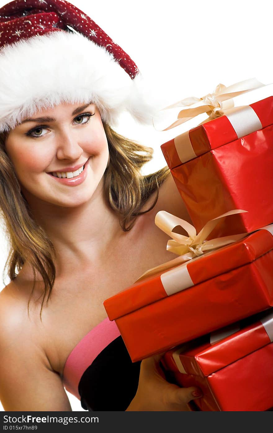 Winter portrait of a beautiful young smiling woman with a christmas cap. Winter portrait of a beautiful young smiling woman with a christmas cap