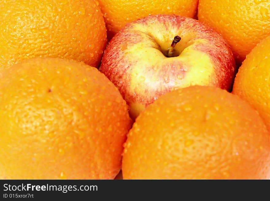 Apples and oranges isolated on a white background. Apples and oranges isolated on a white background