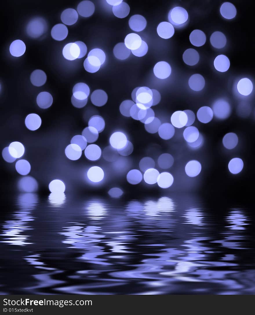 Abstract bokeh background reflected in the water