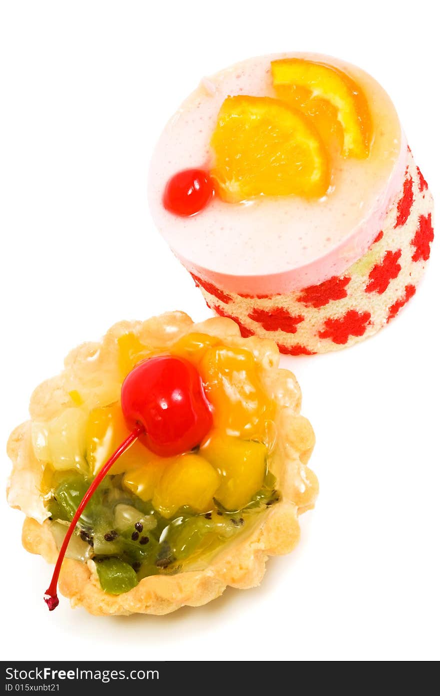 Sweet cakes with fruit on a white background