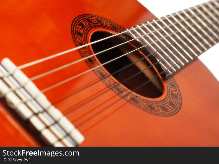 Acoustic six-string guitar. Covered by a brown varnish. Acoustic six-string guitar. Covered by a brown varnish