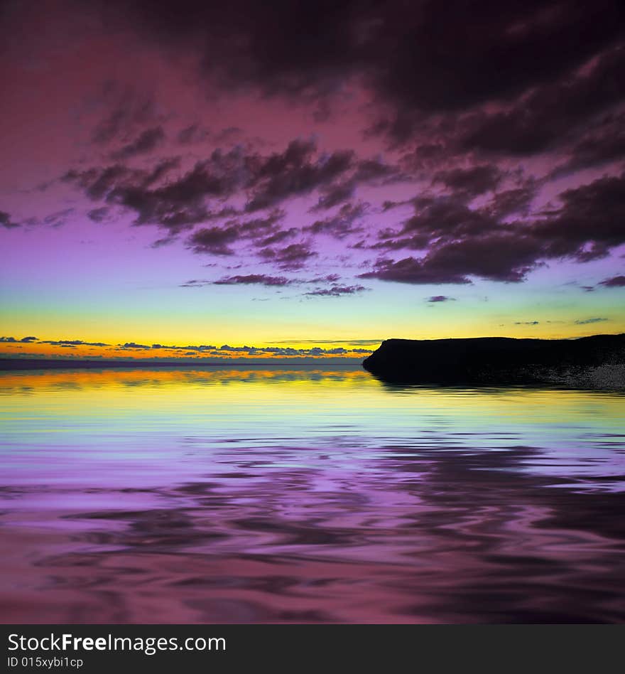 Dramatic violet sky over water