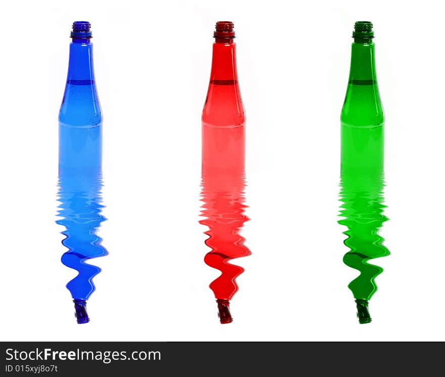 Three colour plastic bottles on the white. Three colour plastic bottles on the white