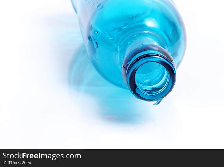 Throat of a blue bottle with a water drop