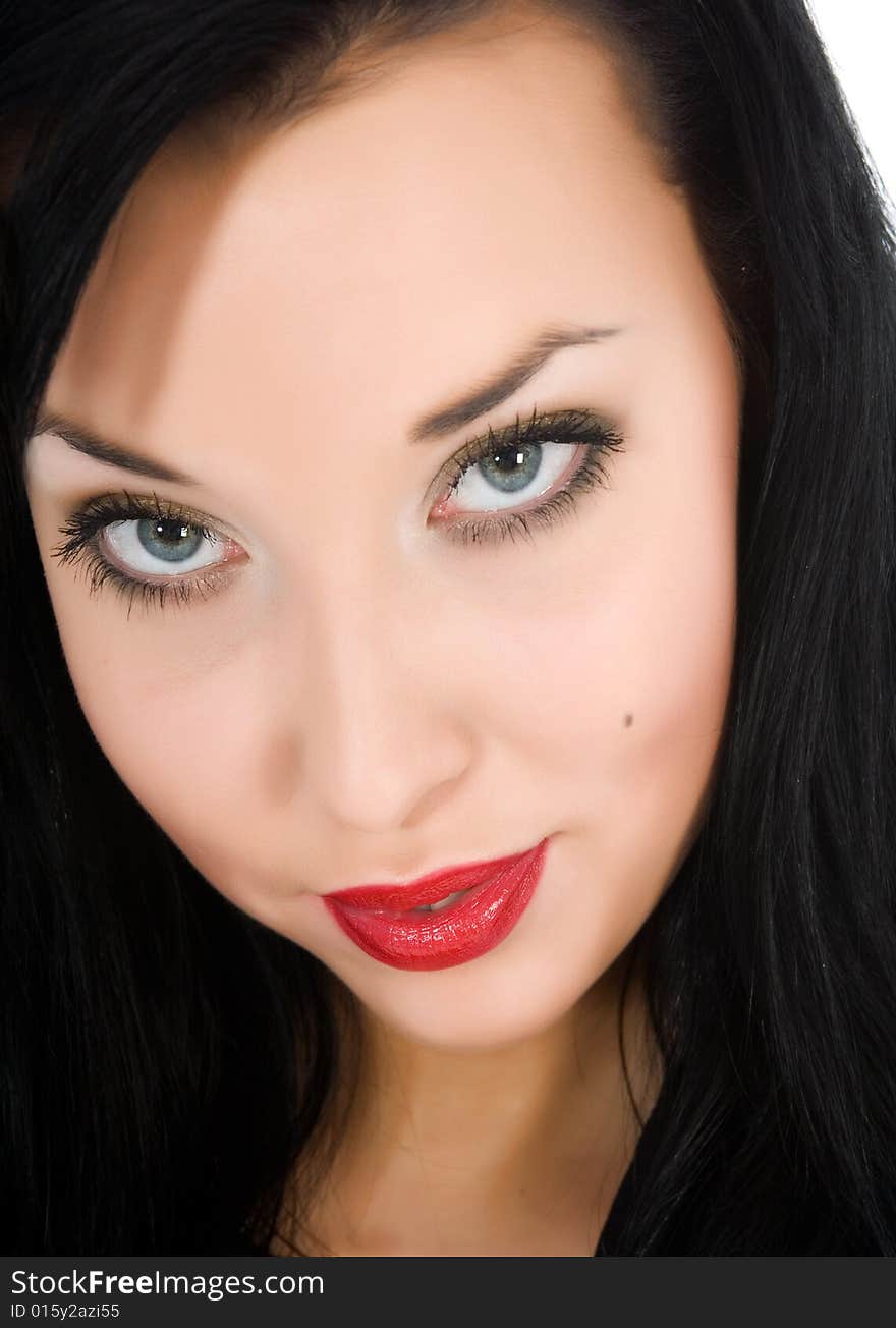 Portrait of the brunette with blue eye on white background