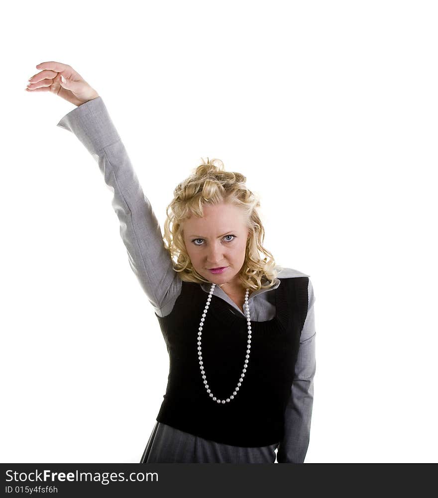 A woman with curly blonde hair and pearls with one arm raised in air. A woman with curly blonde hair and pearls with one arm raised in air